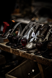 pile of gray metal wood planers placed on brown wooden board thumbnail
