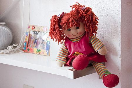 girl in red dress doll on shelf thumbnail