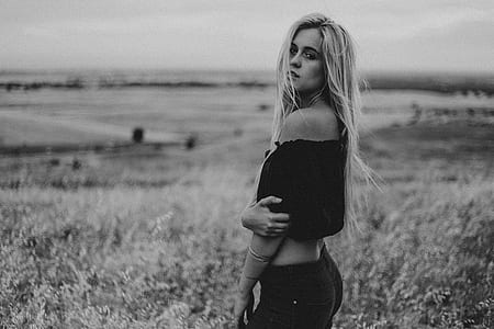 greyscale photo of woman wearing off-shoulder top and pants thumbnail