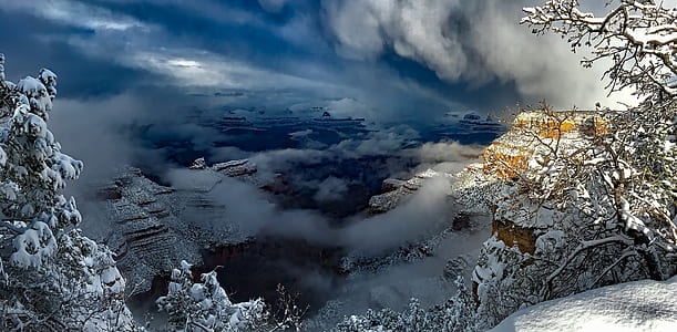 view of mountain covered by clouds thumbnail