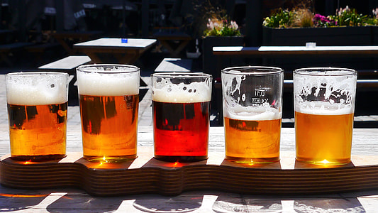 five clear beer glasses on table thumbnail