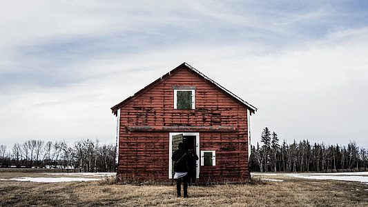 person standing in front of the house thumbnail