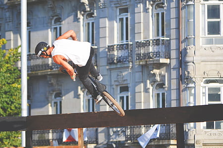 man riding in bike doing exhibition during daytime thumbnail