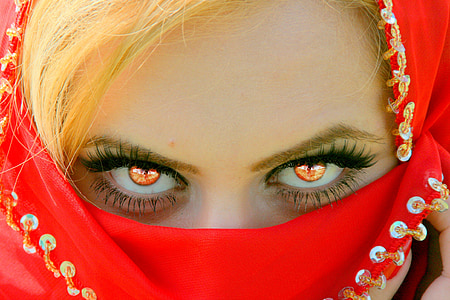 woman covering face with red textile thumbnail