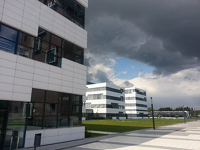buildings near grass field thumbnail