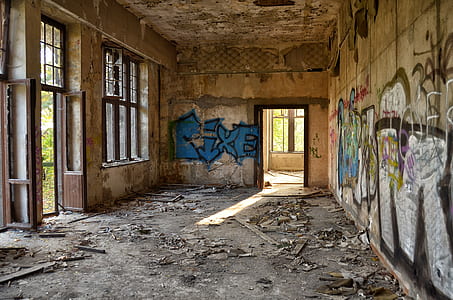 graffiti on wall inside run-down building thumbnail