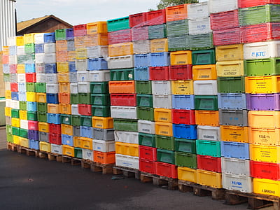 assorted-color plastic crate lot at daytime thumbnail