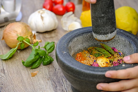 person dicing vegetables in mortar and pestle thumbnail
