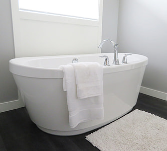 white enamel bathtub with towel thumbnail