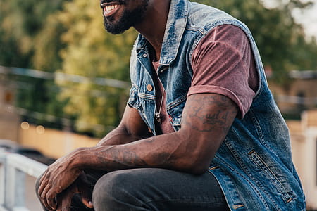 A young bearded African American man relaxing with smile on his face thumbnail