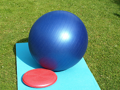 blue stability ball on yoga mat thumbnail