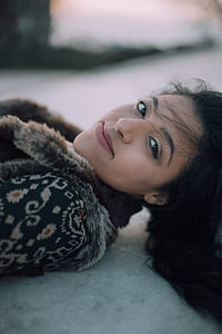 woman lying on beige surface thumbnail