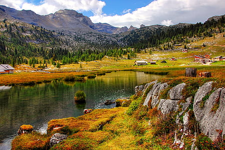 mountain peak near body of water thumbnail