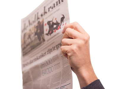 person holding newspaper thumbnail