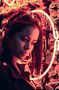 woman beside red neon light signage thumbnail
