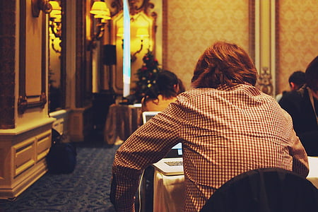 person sitting in front of laptop computer thumbnail