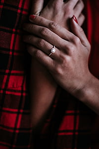 person wearing silver-colored clear gemstone encrusted ring thumbnail