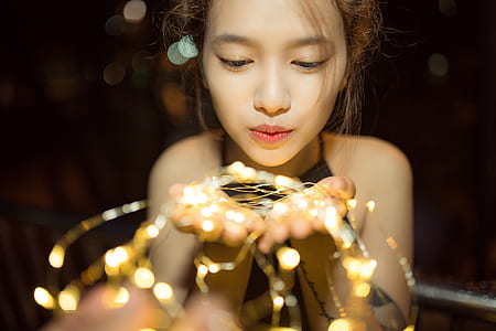 photo of woman blowing her hands thumbnail