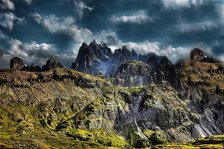 rock formation under cloudy sky thumbnail