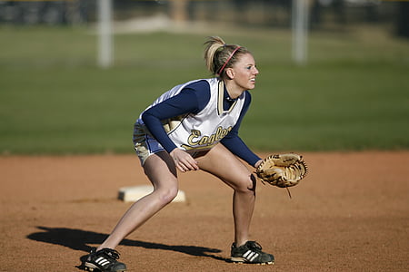 selective focus photography of woman wearing baseball jersey and baseball mitt thumbnail