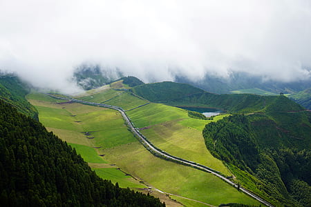 scenery of a volcano under white clouds thumbnail