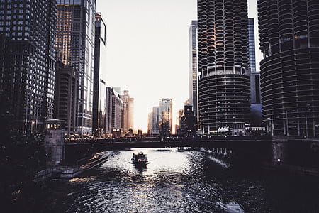 photo of body of water between high rise buildings thumbnail