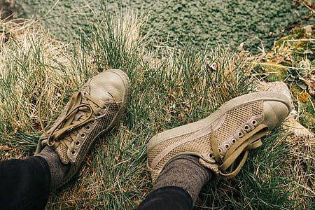 person wearing brown Puma shoes thumbnail
