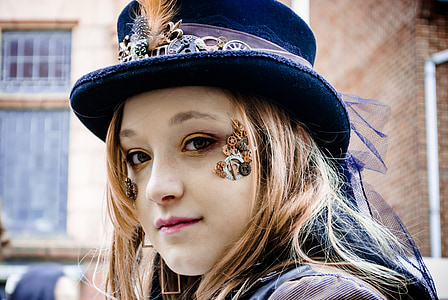 woman wearing blue hat during daytime thumbnail