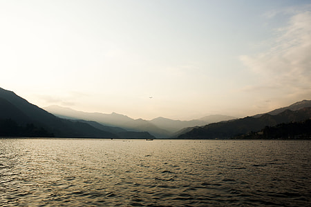 mountains near body of water thumbnail