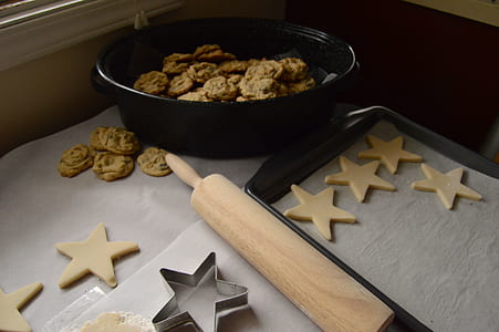 brown rolling pin beside bowl and tray thumbnail