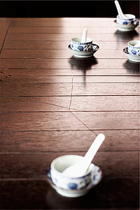 white ceramic soup bowl with spoon on table thumbnail