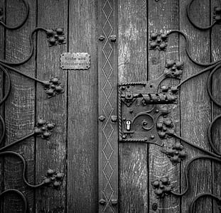 Wooden Door in Grayscale Photography thumbnail