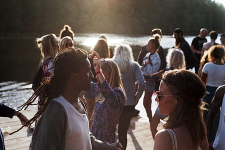 , people gathered near lake thumbnail