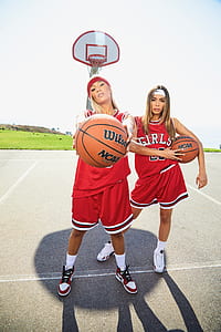 woman holding Wilson basketball thumbnail