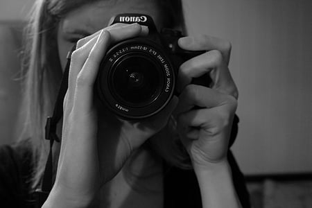 grayscale photo of woman takes photo thumbnail