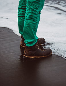 person standing near seashore during daytime thumbnail
