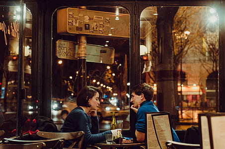man and woman sitting on chair thumbnail