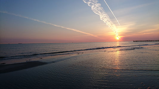 sunset across body of water thumbnail