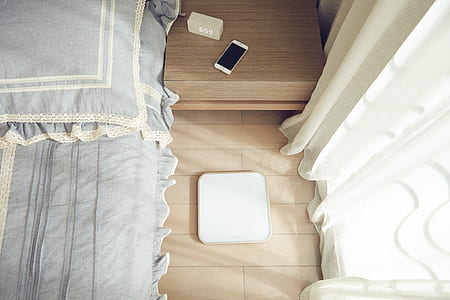 square white panel on brown wooden surface thumbnail