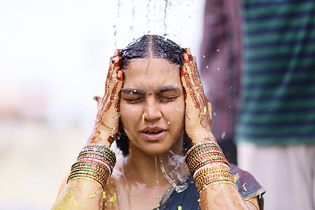 Woman Taking Shower While Wearing Sari Dress thumbnail