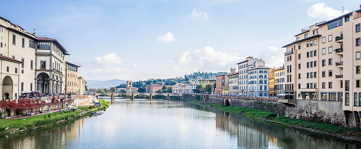 body of water in between buildings during daytime thumbnail