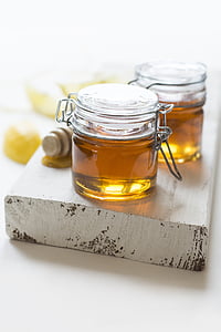 two clear glass hermetic jars with brown liquid thumbnail