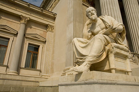 man sitting on chair statue thumbnail