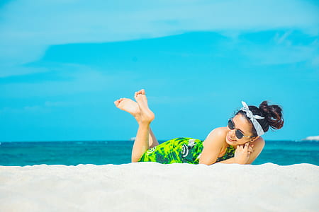 woman laying on seashore thumbnail