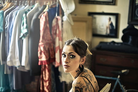 Young Woman with many tattoos sitting on chair thumbnail