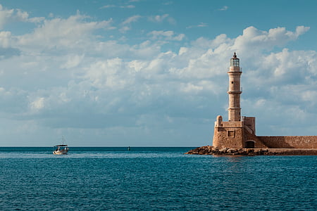 gray lighthouse near body of water photography thumbnail