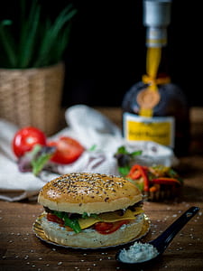 selective focus photo of burger with cheese and tomato thumbnail