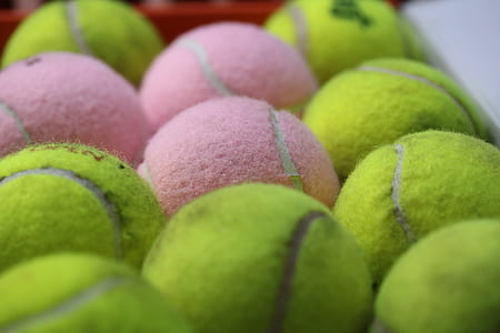 close-up photography of tennis balls thumbnail