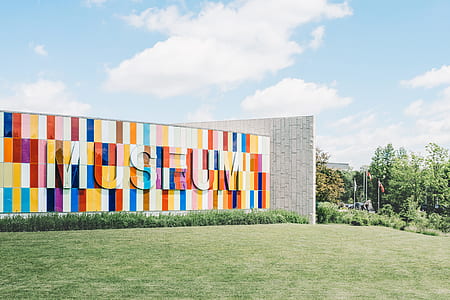 colorful museum wall under white clouds thumbnail