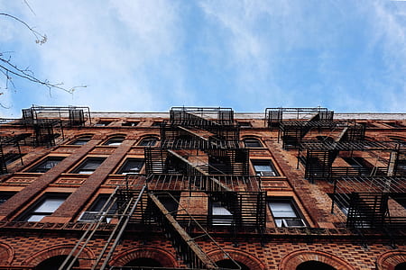 black steel railings beside brown building thumbnail